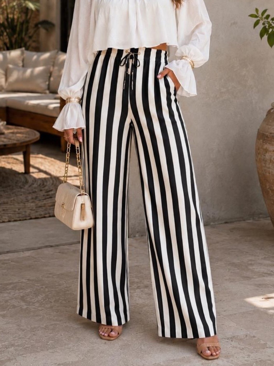 Calça pantalona listrada