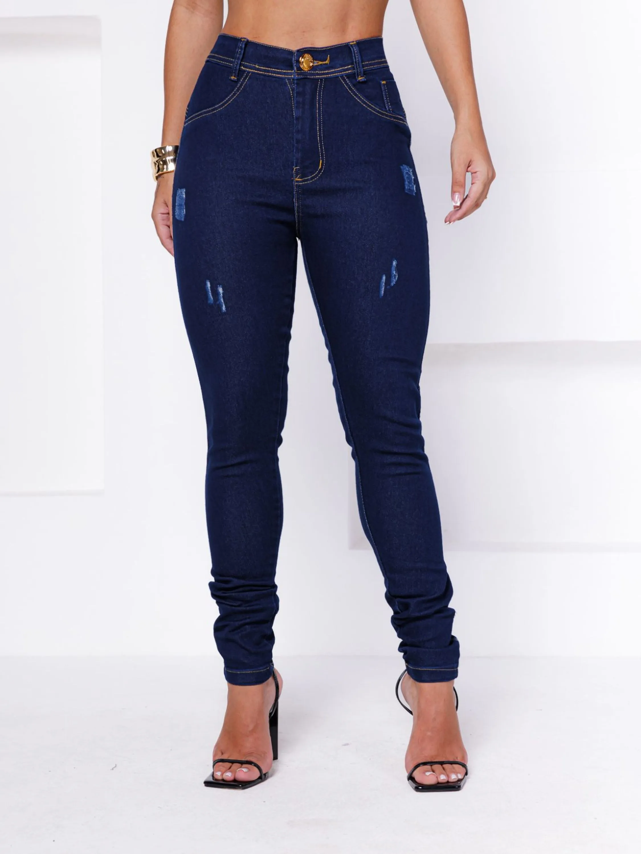 CALÇA SKINNY AZUL ESCURA COM LEVES RASGOS