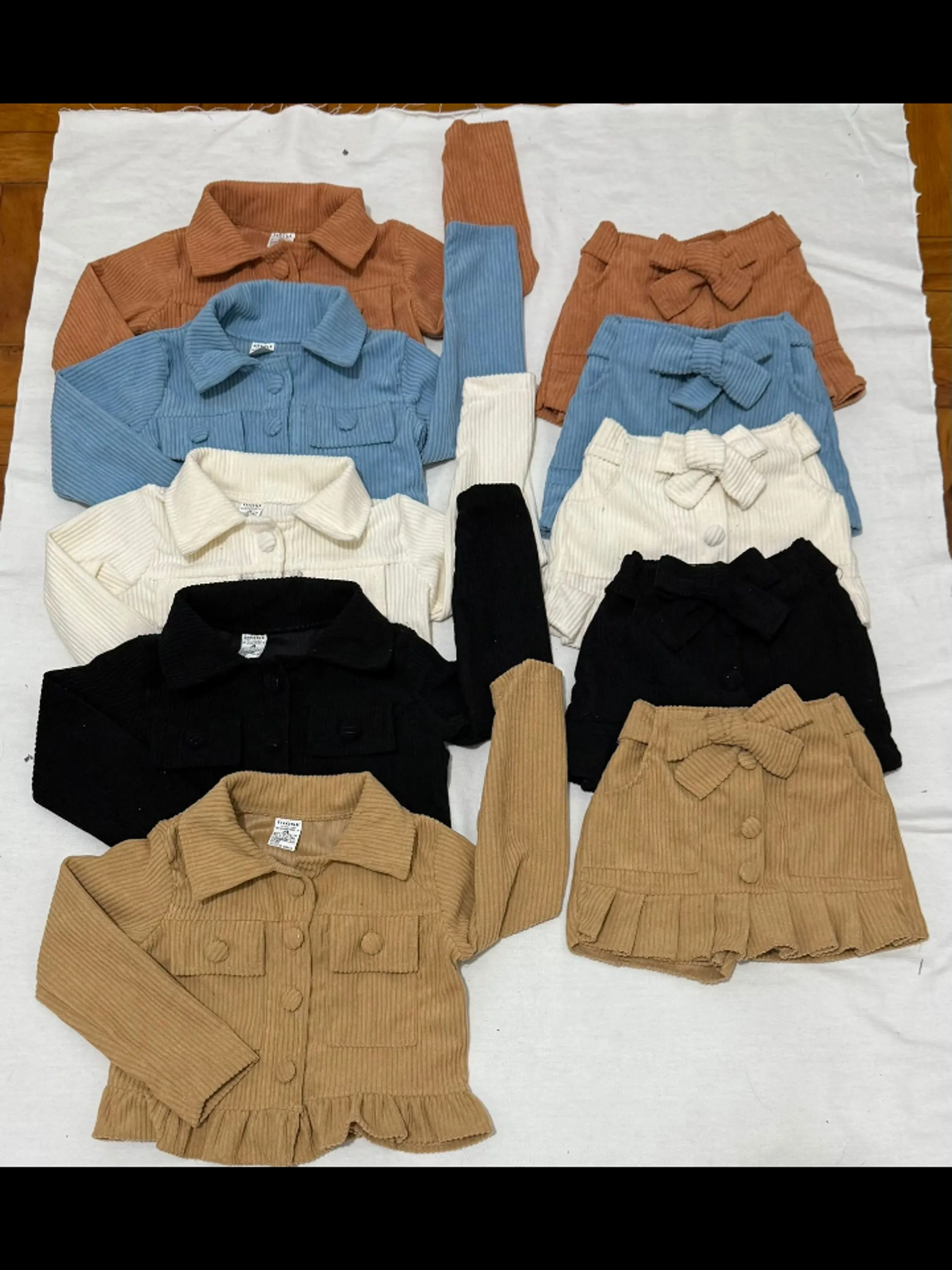 Conjunto infantil shorts saia e casaquinho