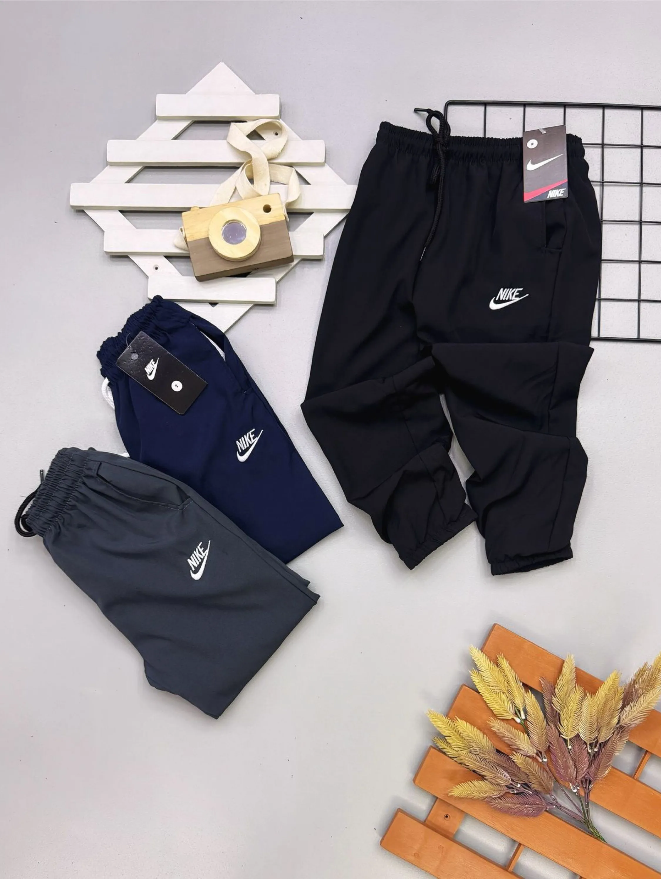 Calça tactel Nike infantil/juvenil