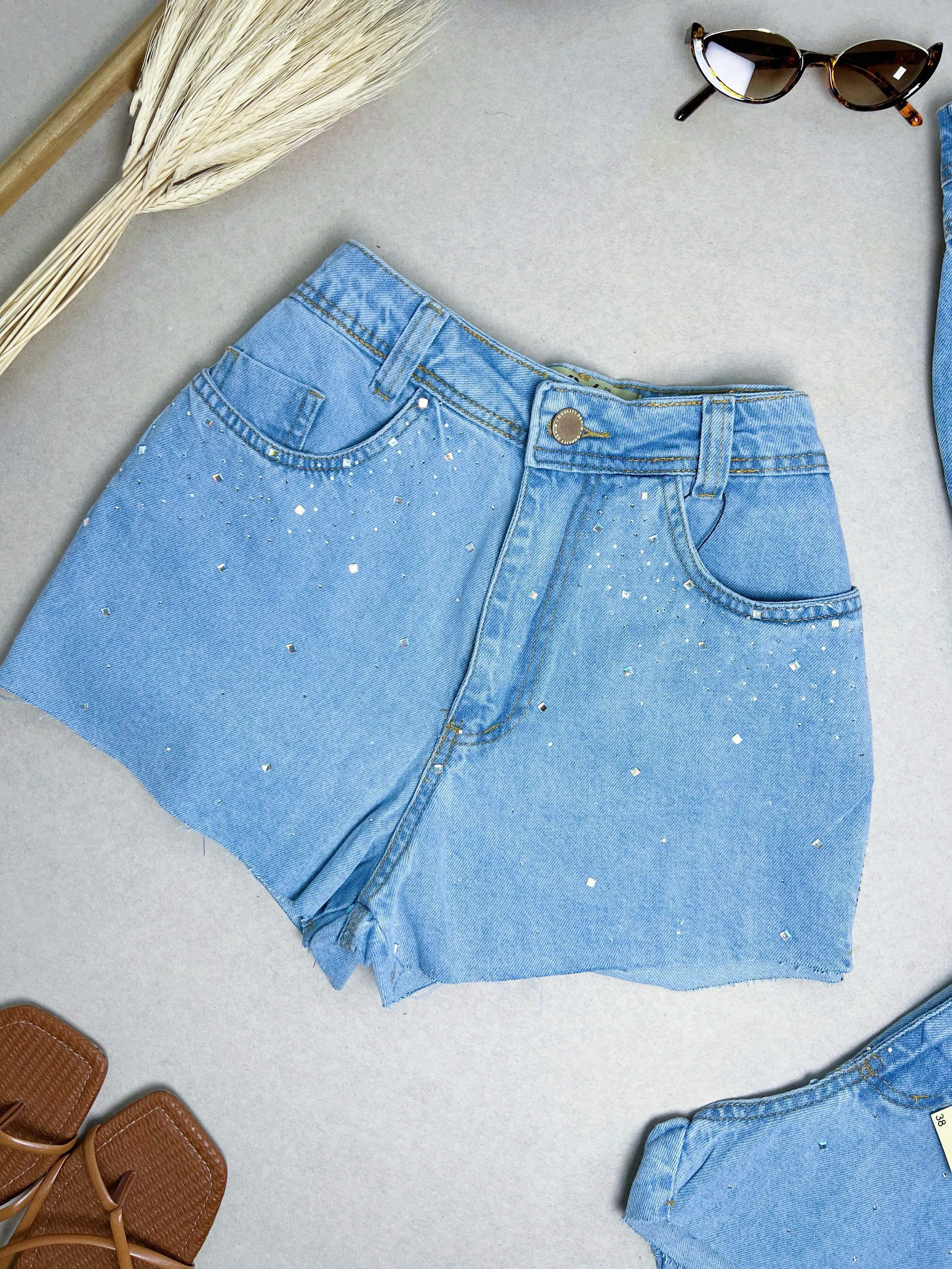 Short jeans chuva de pedras