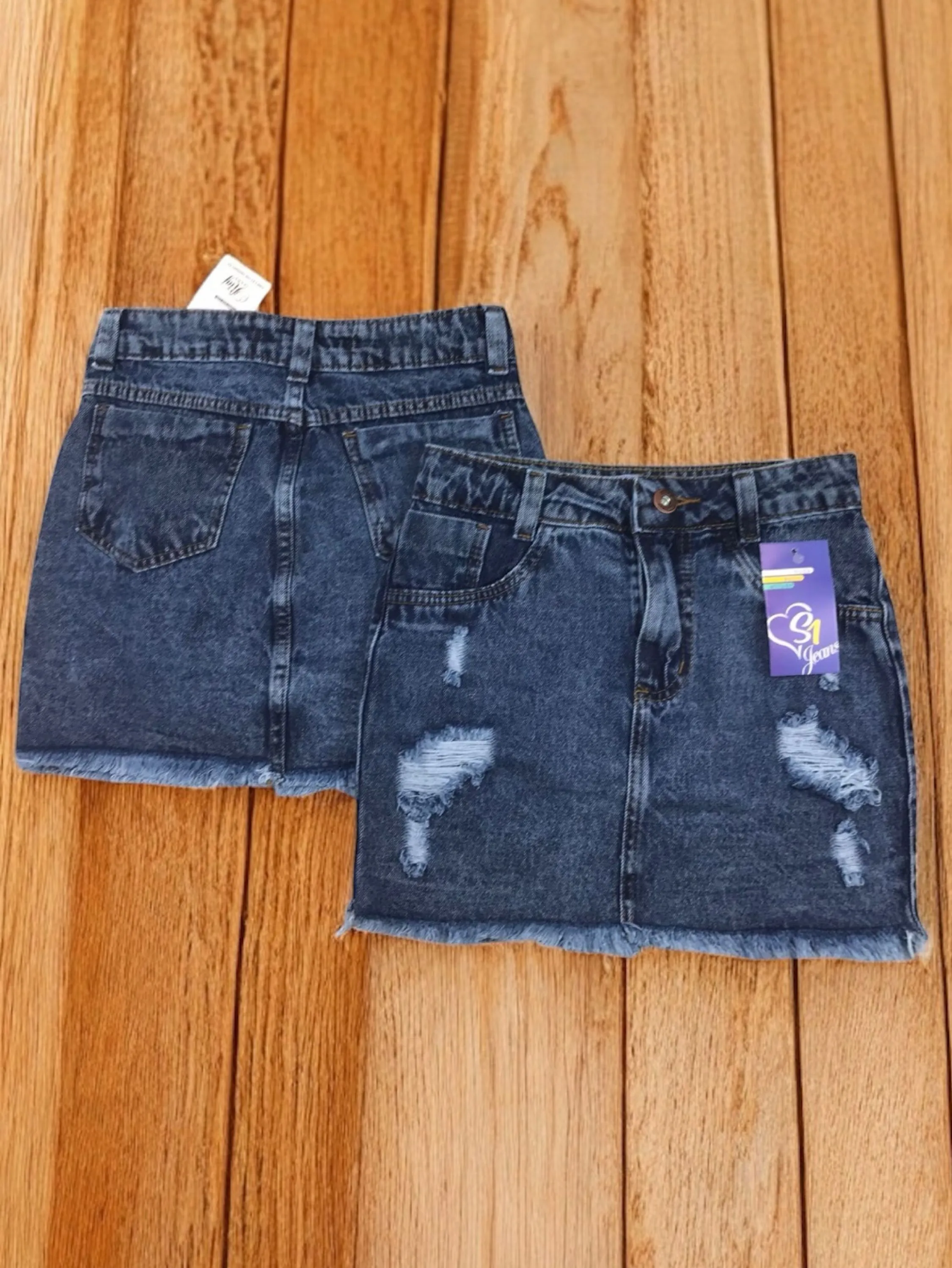 Saia jeans feminina escura barra desfiado