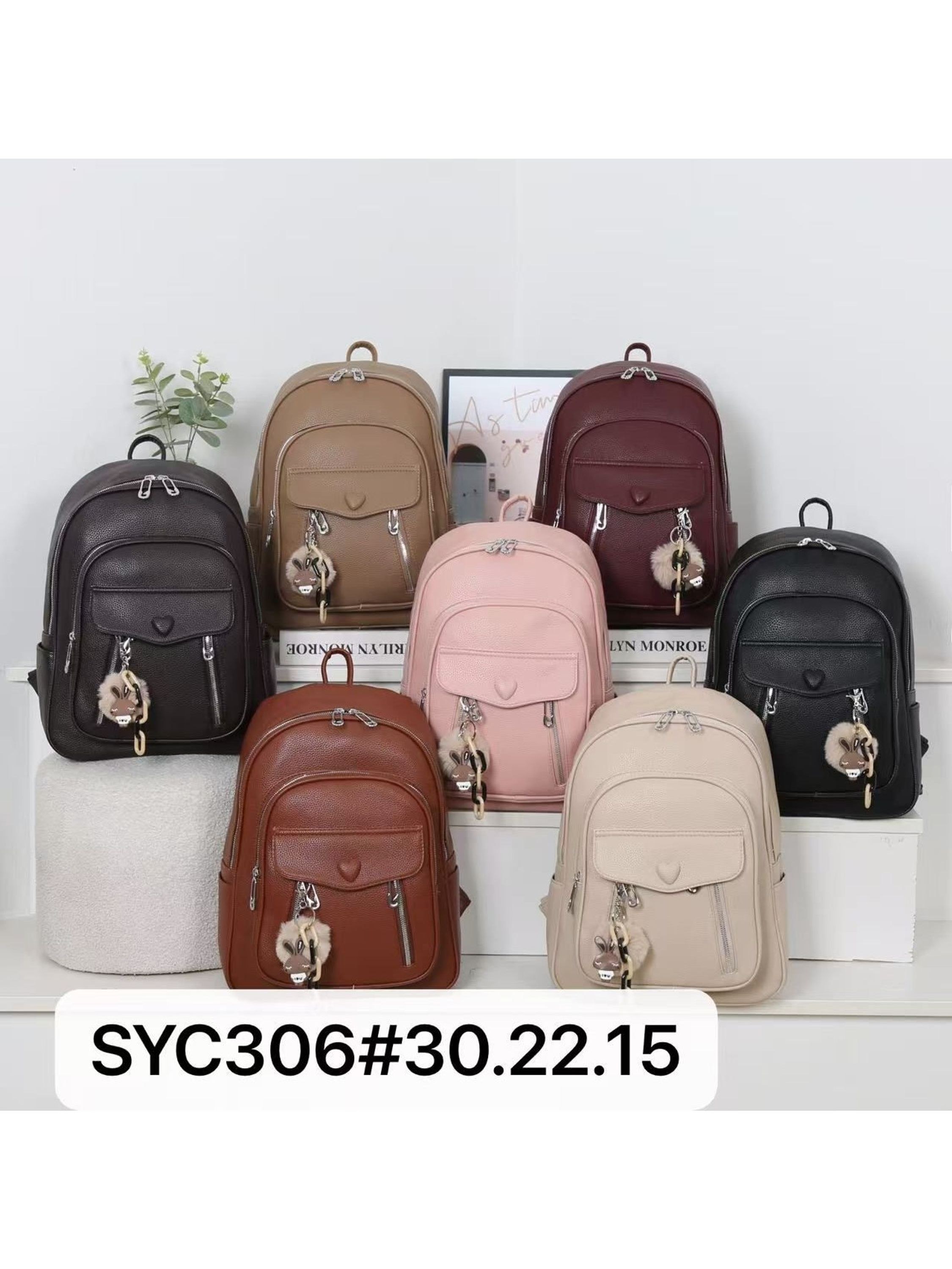 Mochila pequena com pompom Feminina Oscar Bolsas Modas