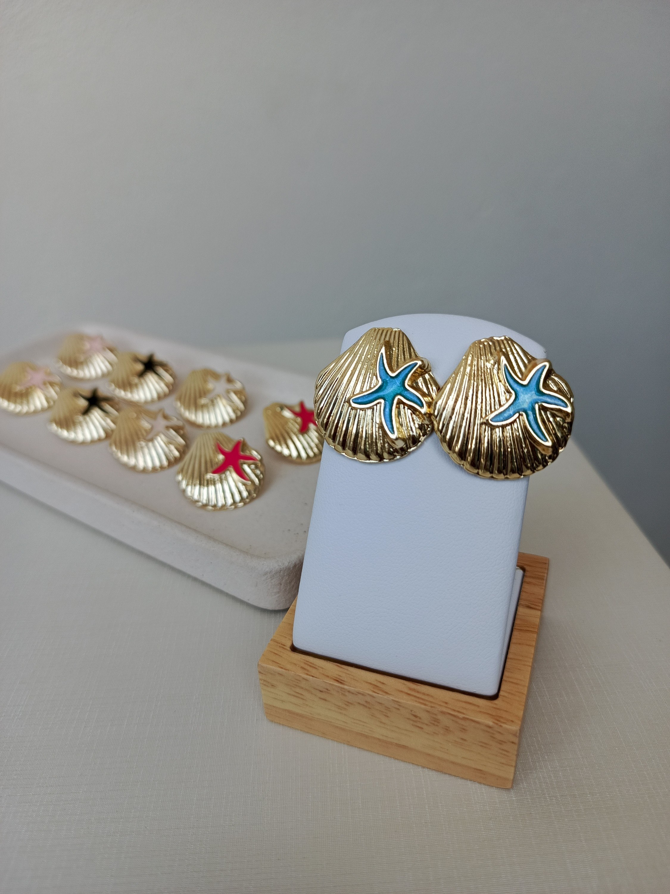 Brincos de concha com estrela