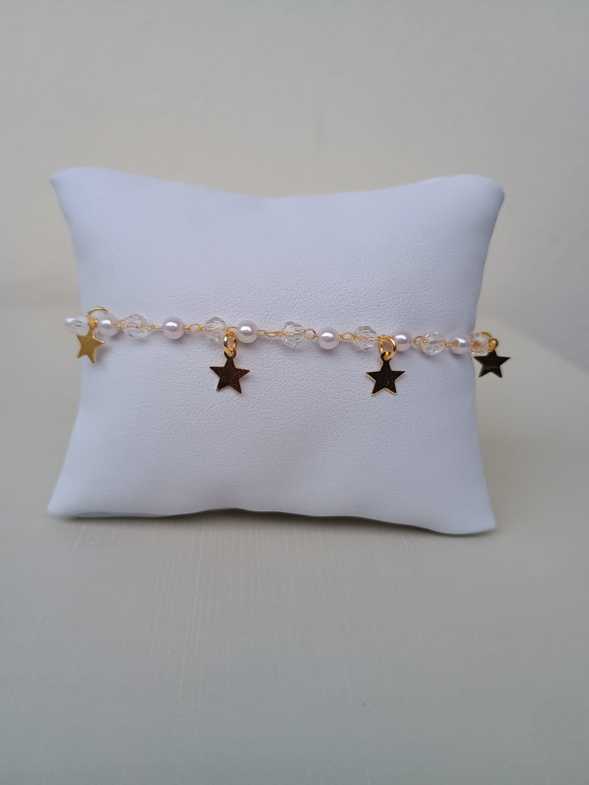 Pulseira de pérolas e estrela