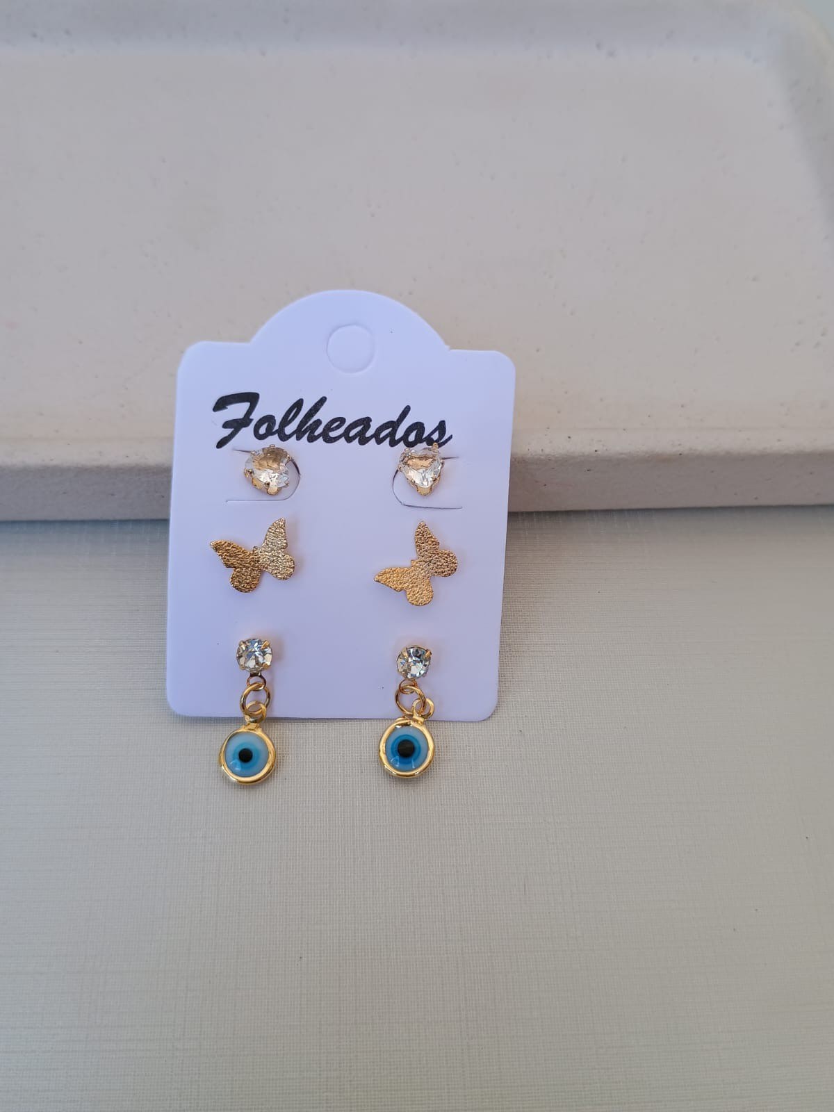 Trio de brincos com olho grego