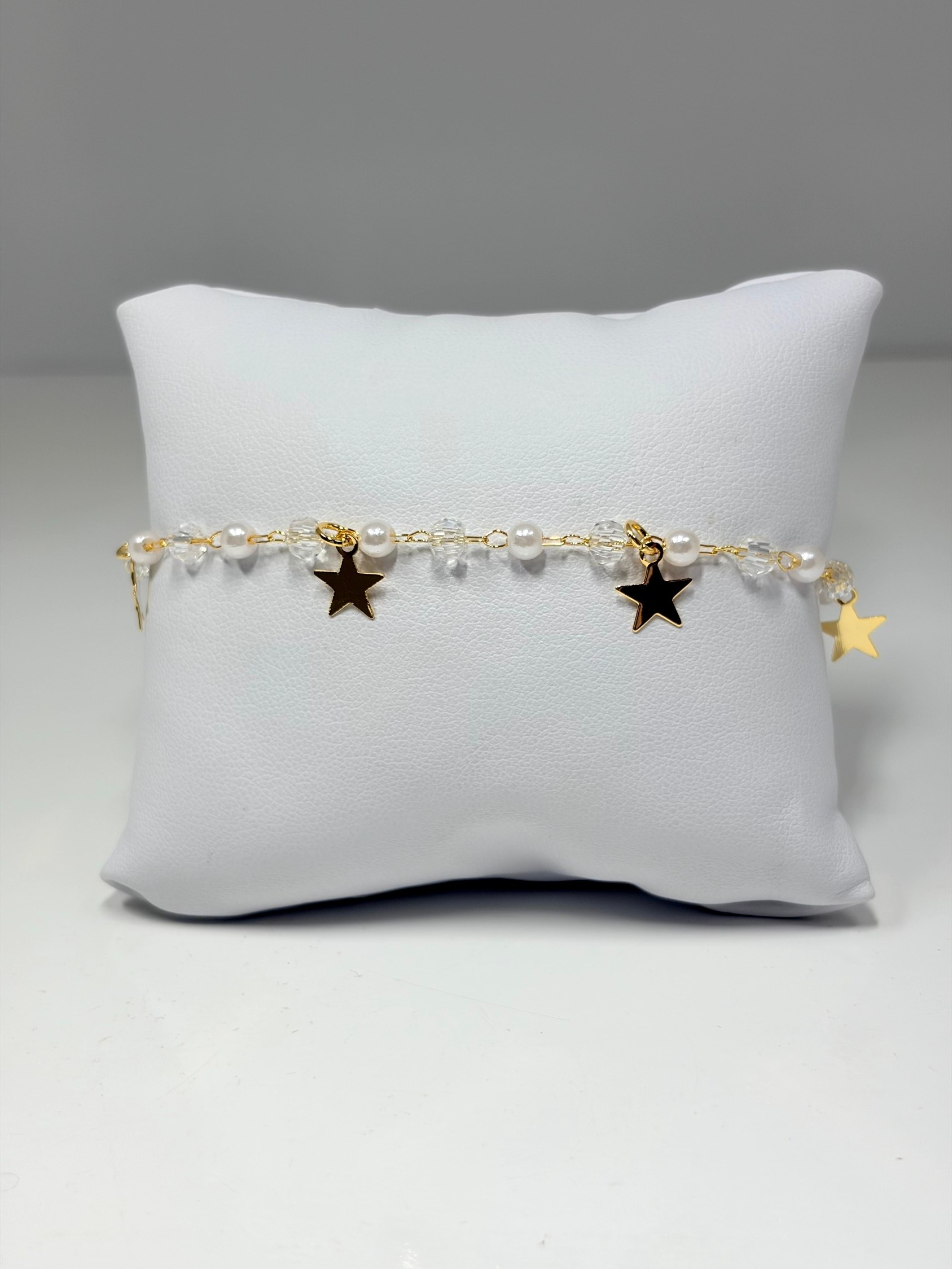 Pulseira com bolinhas e estrelas