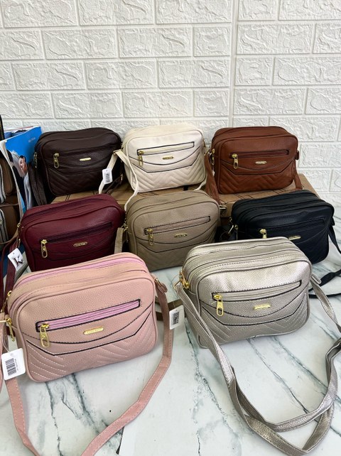 Bolsa transversal feminina simples em ziper fechado